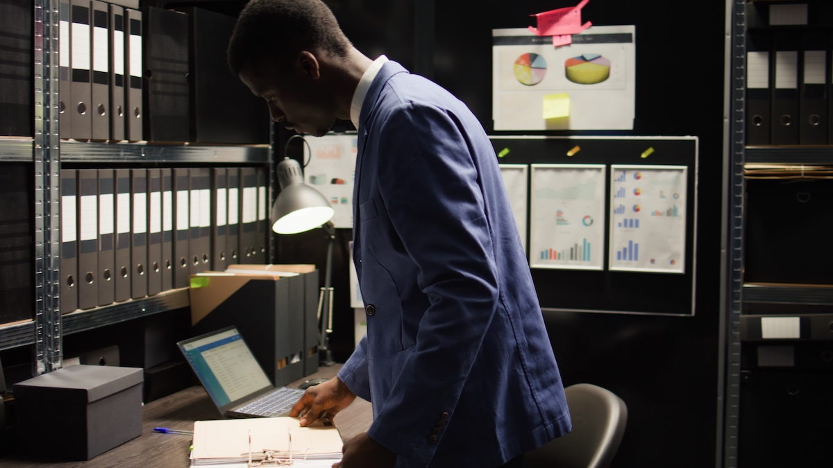 African american agent analyzes evidence